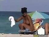 Busty MILF Tanning At Nude Beach
